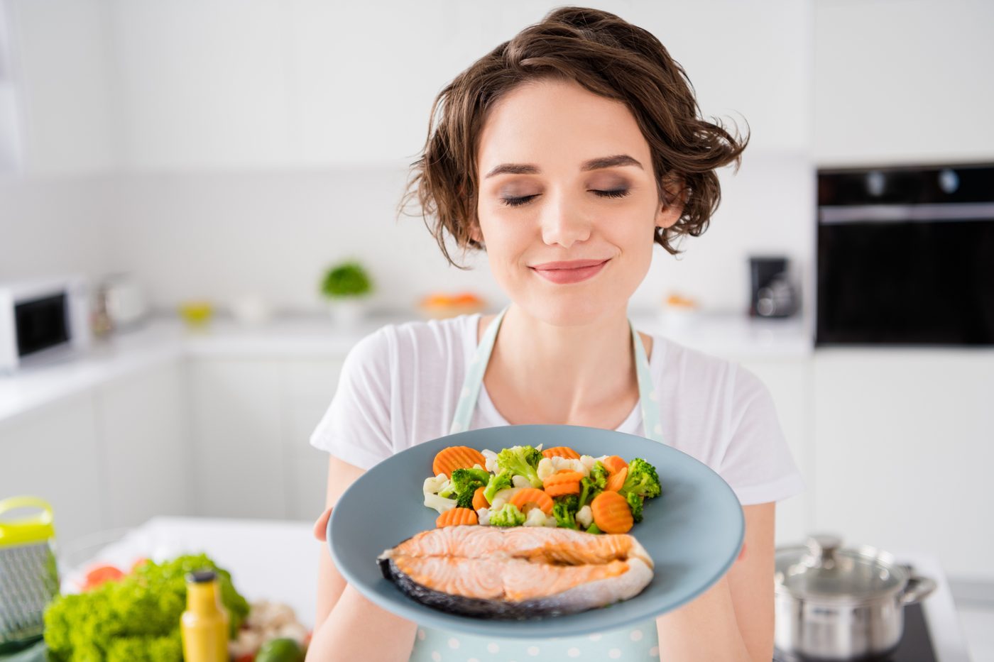 A cooked salmon and vegetable meal