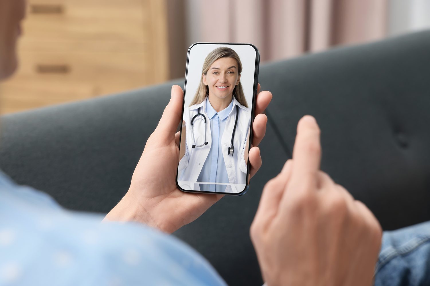 A patient speaking to a GP by video call