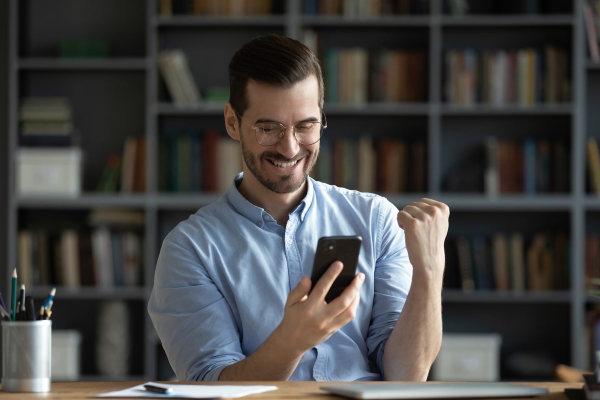 Man reading his result on a phone