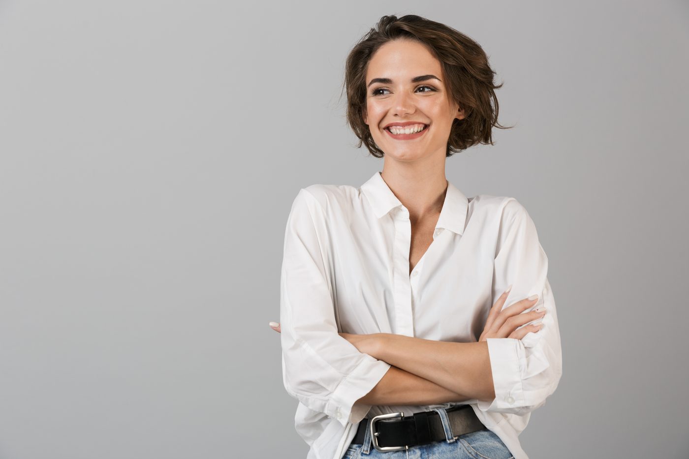 A woman standing with her arms folded